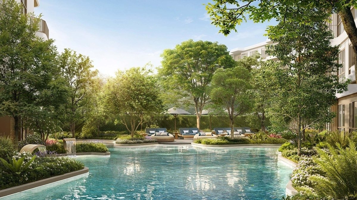 The Title Balcony — lagoon pool with a sunbathing lounge among the trees